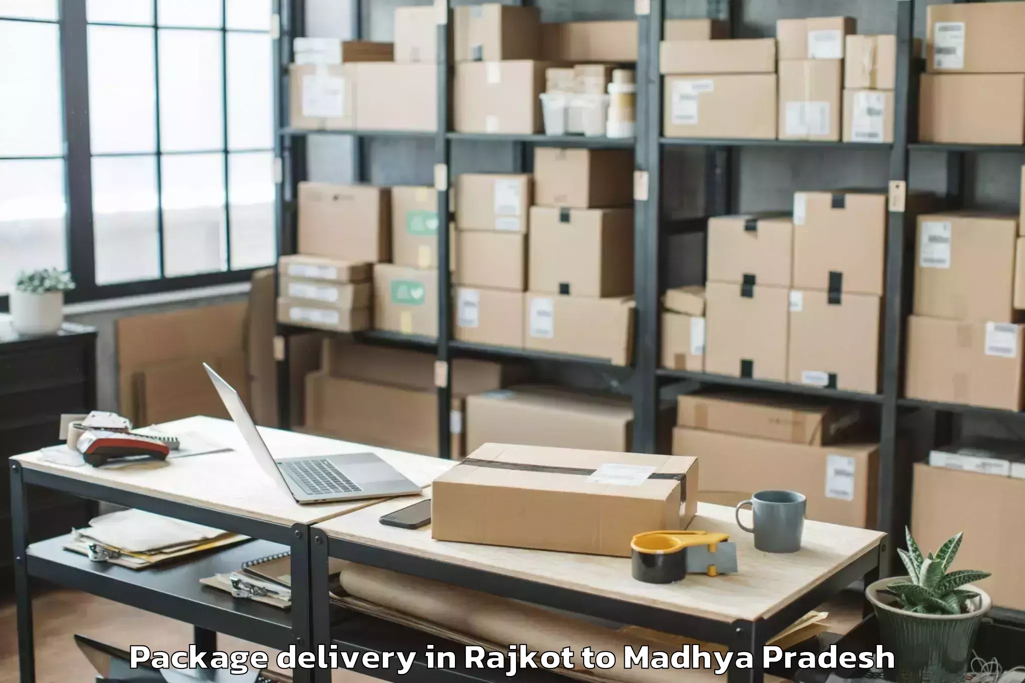 Quality Rajkot to Meghnagar Package Delivery